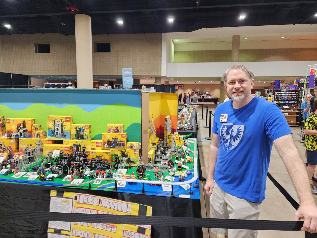 A member beside a colorful LEGO® city