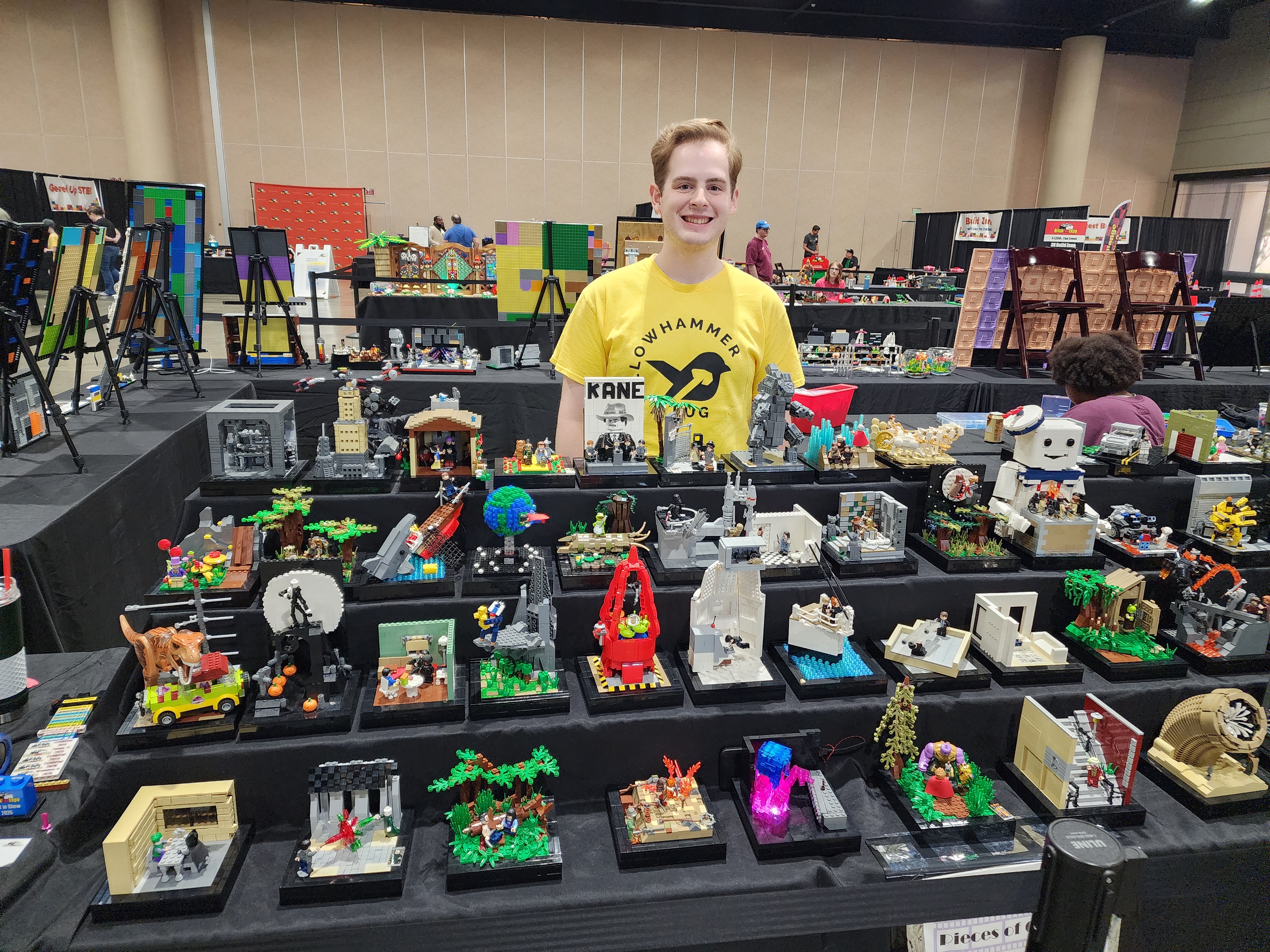 A member beside their MOC collection