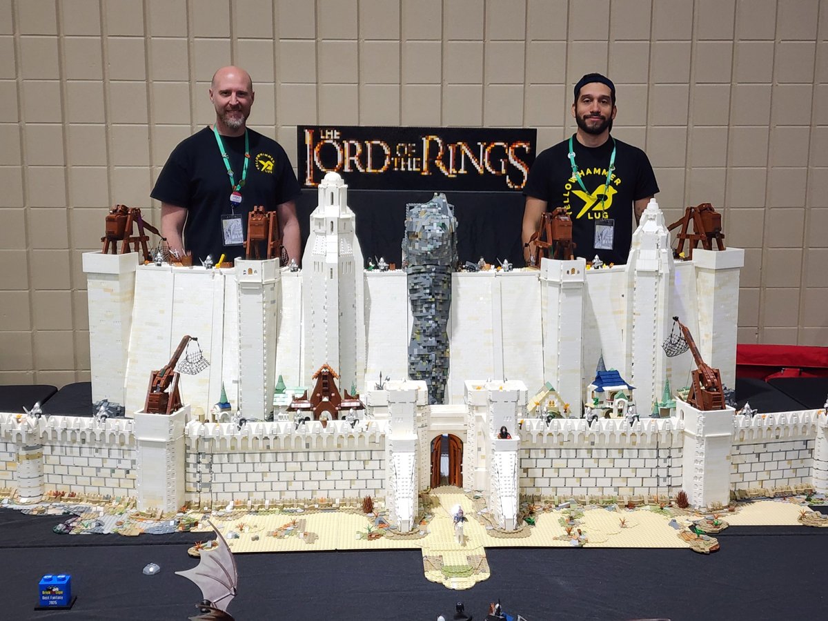 Members displaying a large LEGO® castle